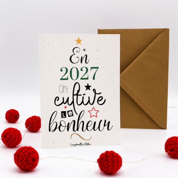 Carte à planter 2027 – En 2027, on cultive, présentée avec des pompons rouges